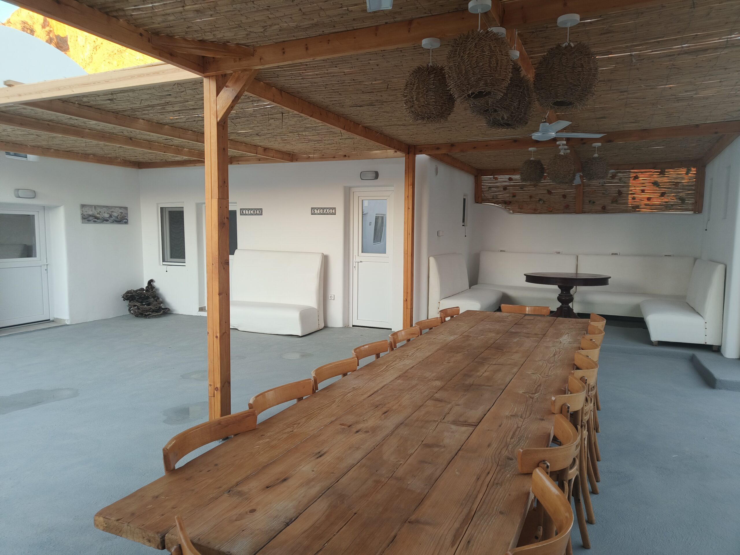 Cozy hostel common area with wooden dining table