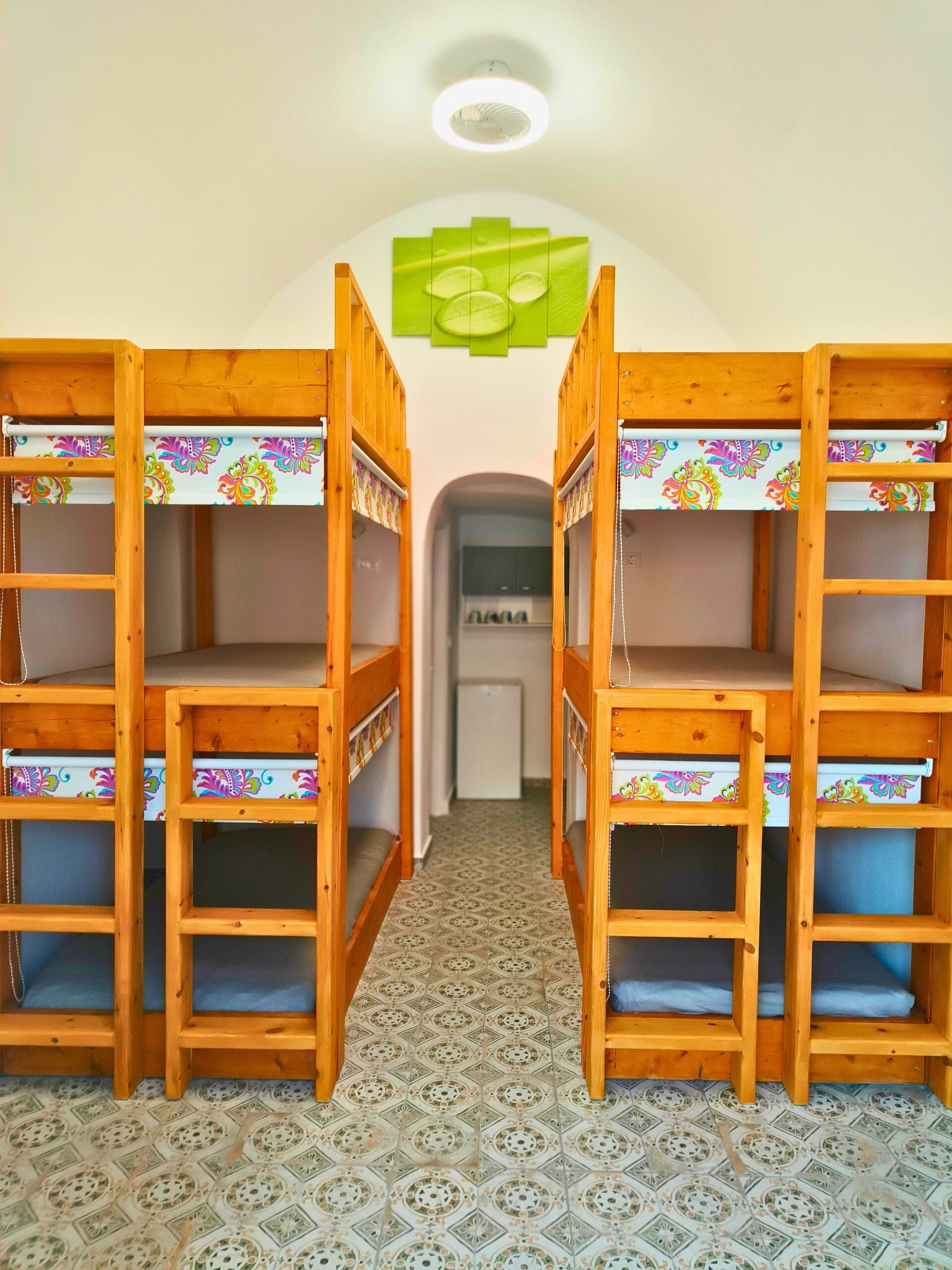 hostel dorm room with wooden bunk beds